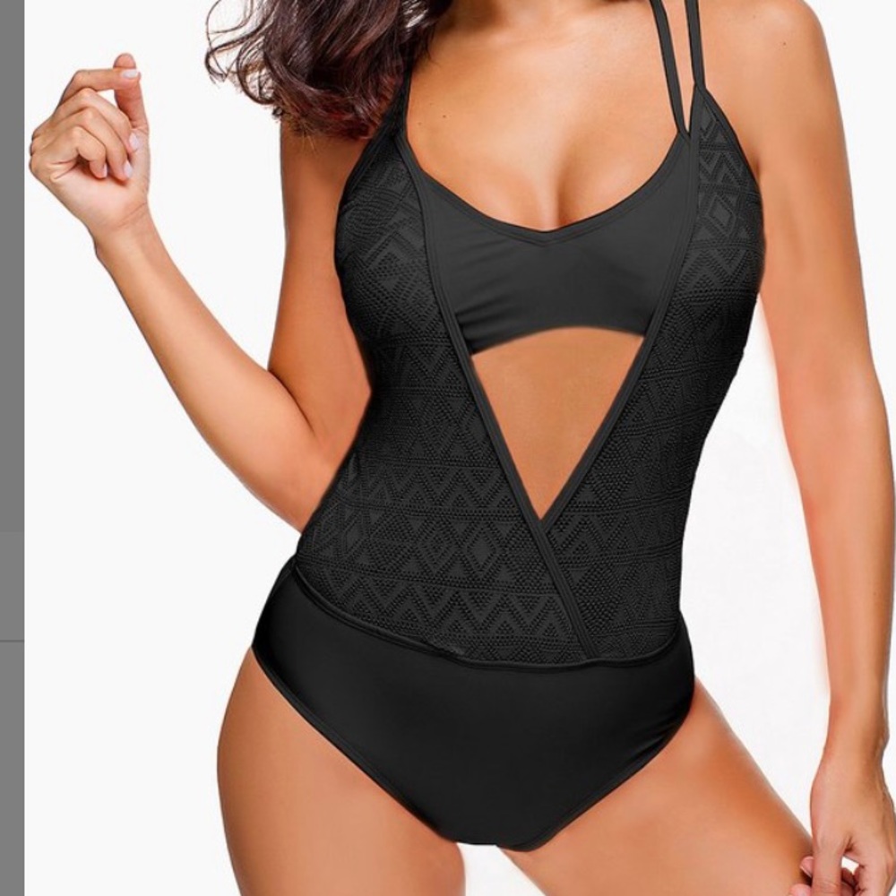 New with tags. Black cut out swim suit size small.